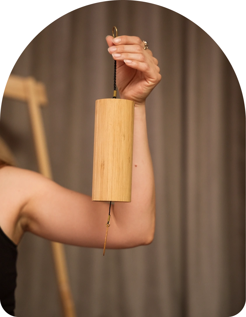 A koshi chime in the teacher's hand